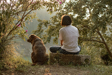 Girl with dog in nature