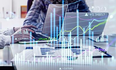 Wall Mural - Consulting colleagues working on statistics to boost clients business to a new level of income. Side view of woman's hand using laptop, double exposure graph, internet trading