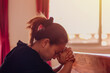 © puttipong - People go to church for Sunday prayers,and standing apart,new normal,social distancing,coronaviruses influenza.