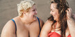 © DisobeyArt - Curvy women sitting on the beach having fun during summer vacation - Focus on right female face