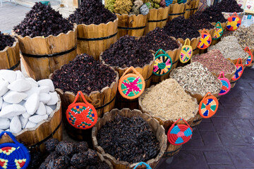 Natural dry herbal teas in the wooden baskets on the street market