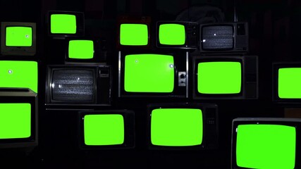 Wall Mural - retro tvs turning on and off green screen. dark tone. zoom out. you can replace green screen with th