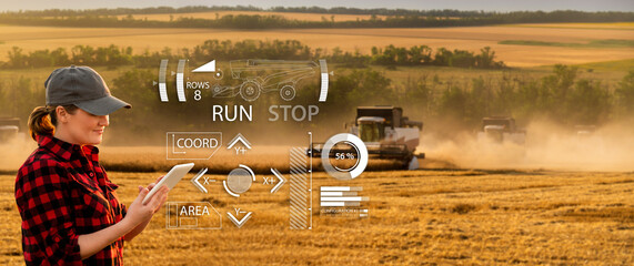 Sticker - Remote control of an autonomous combine in the field.  Farmer  with a digital tablet in the agricultural field.