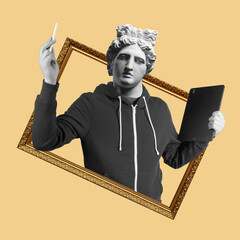 Modern art collage. Concept portrait man holding tablet and pencil. Gypsum head of Apollo.