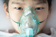 © TinPong - Young asian boy with face oygen mask