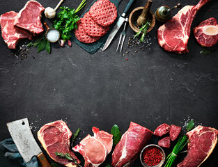 Assortment of raw cuts of meat, dry aged beef steaks and hamburger patties