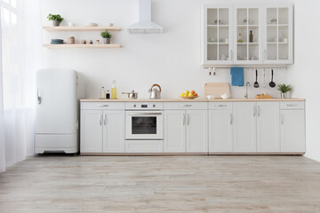 Wall Mural - White scandinavian kitchen interior with dining room and wooden floor