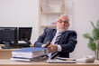 © Elnur - Aged businessman angry with excessive work in the office