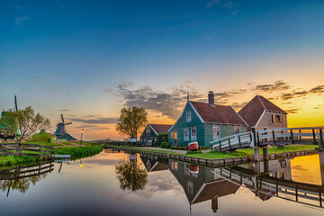 amsterdam netherlands, sunrise landscape of dutch windmill and traditional house at zaanse schans vi