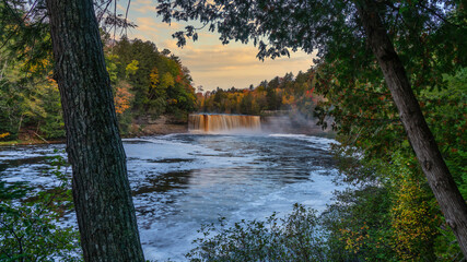 Canvas Print - Pre dawn blue hour peak through of Upper Tahquamenon Falls in Autumn - Michigan State Park in the Upper Peninsula - waterfall