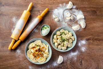 Wall Mural - dumplings with meat and dumplings with potatoes. Filled dough dishes 