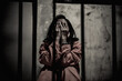 © reewungjunerr - Portrait of women desperate to catch the iron prison,prisoner concept,thailand people,Hope to be free,If the violate the law would be arrested and jailed.