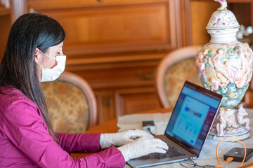 Poster - Woman working from home  wearing face mask in pandemic time