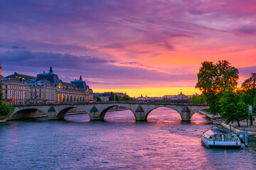 Wall Mural - Sunset view of Seine river, Pont Royal and Orsay Museum (Musee d'Orsay) in Paris, France