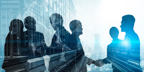 Wall Mural - silhouette view of business people team in group meeting on city office building background showing 