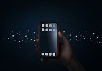 Woman holding smartphone with blank display or screen at night with app and applications
