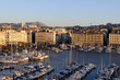 Overlooking Vieux-Port with boats and apartment buildings at sunset, Marseille, Bouches-du-Rhone, Provence-Alpes-Cote d'Azur, France