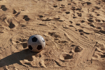 soccer ball on the sand