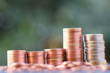 stack of coin on table background and business or finance saving money