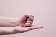 Female hands showing sign HELP. American sign language concept. Closeup, copy space