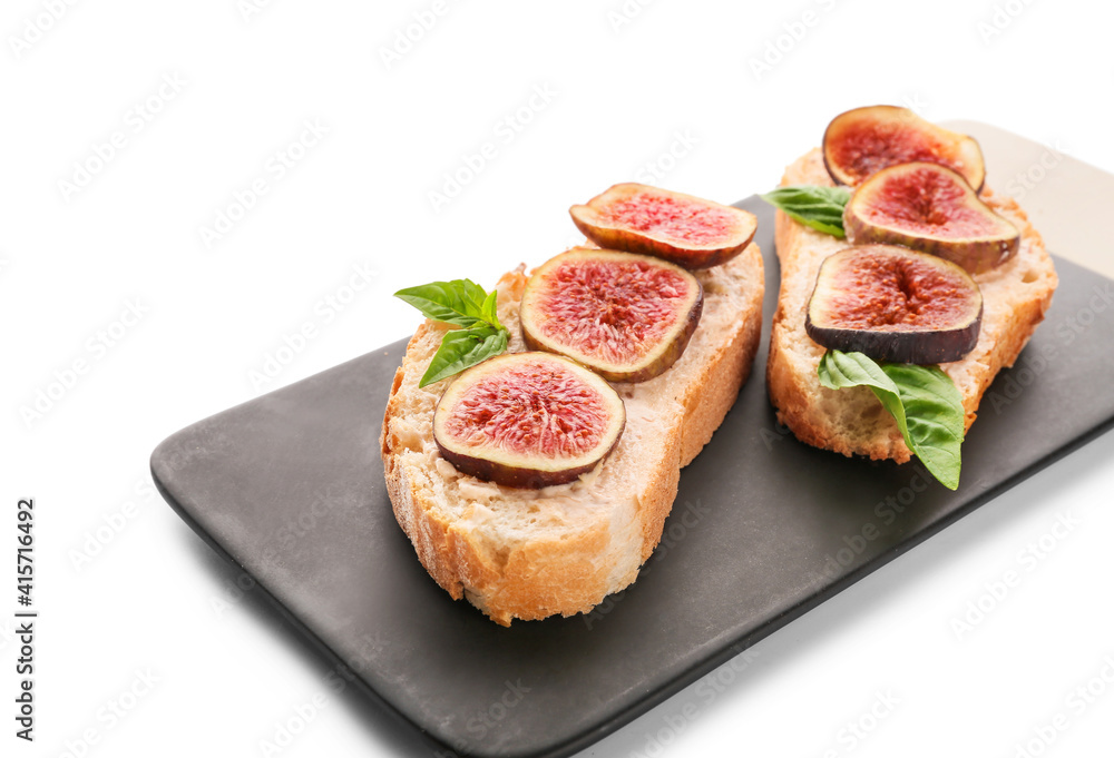 Tasty sandwiches with fig on white background