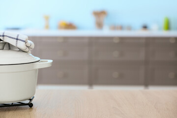 Wall Mural - Cooking pot on table in modern kitchen