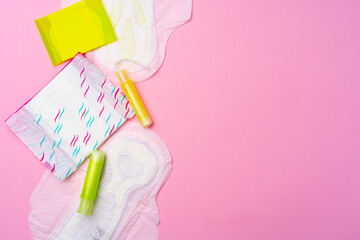 Wall Mural - Female hygienic pad and tampons on pink background