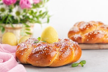 Poster - Happy Easter.  Sweet Easter bread with colored eggs and flowers.