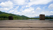 © suppa - Panoramic view of Wooden bridge lake with Green mountain, bright blue sky and lake at the background with Empty wooden floor. can be used for display product Mock Up. Panoramic Nature Scene.