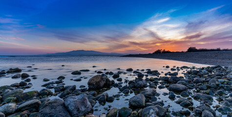 Poster - colorful sunset on the Mediterranean Sea in Almeria with rocks and tidal pools in the foreground