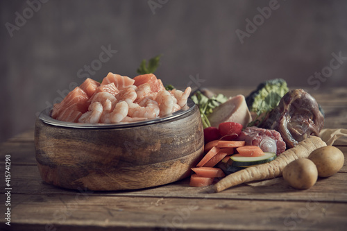 Bowl with raw fresh seafood near various cut ingredients © exclusive-design