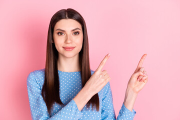 Sticker - Photo of young charming lovely smiling cheerful girl point finger copyspace advertisement isolated on pink color background