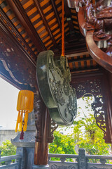 Wall Mural - Beautiful traditional decorations and details on the roof of the temple at Vinh Nghiem monastery in Ho Chi Minh city, Vietnam