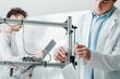 © StockPhotoPro - Engineers in the lab using a 3D printer