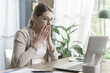 © StockPhotoPro - Stressed woman receiving bad news online