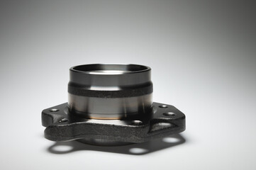 auto hub bearing new on gray background. metal spare part for front suspension