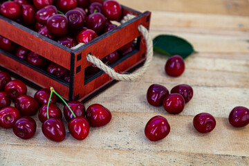 Wall Mural - Ripe cherries in a wooden box.