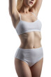 © filin174 - Slim tanned woman's body. Isolated over white background