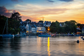 View of the scenic port of Sainte Marine at night in Finistère, Brittany, France