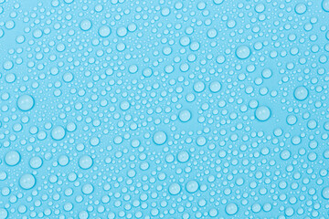 Water drops on blue background texture. Backdrop glass covered with drops of water. bubbles in water