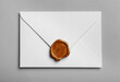 White envelope with wax seal on grey background, top view