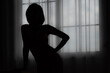 © ic36006 - Silhouette Woman Standing By Window At Home