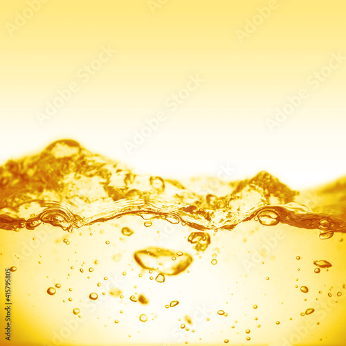 Liquid yellow wave line.  Oil, honey, beer, juice, shampoos. © Vitaly Korovin