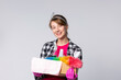 © Viorel - Portrait of maid service woman with cleaning equipment presenting on gray background. Beautiful fresh energetic caucasian female model is ready for work on gray background