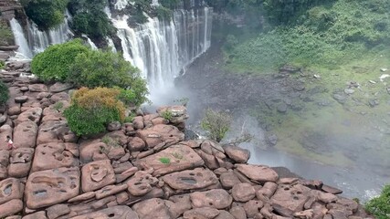 approaching calandula waterfalls in angola looking down on the waterfalls the water hitting the blac