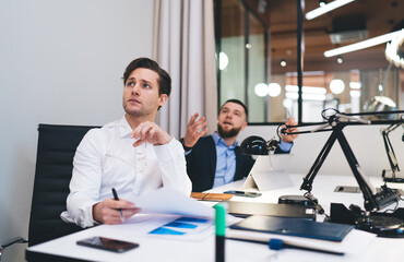 Wall Mural - Confident businesspeople working on project together