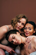 © oneinchpunch - Group of multiethnic women with different kind of skin posing together in studio. Concept about body positivity and self acceptance