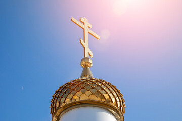 Golden cross and dome on the dome of the Orthodox Church. Cross in Christianity is traditionally a religious symbol of Christianity and an object of religious veneration