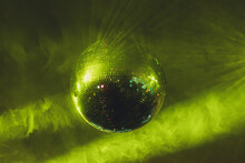Sparkly Disco Ball In Under Green Light