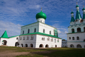 beautiful white monastery with green roof